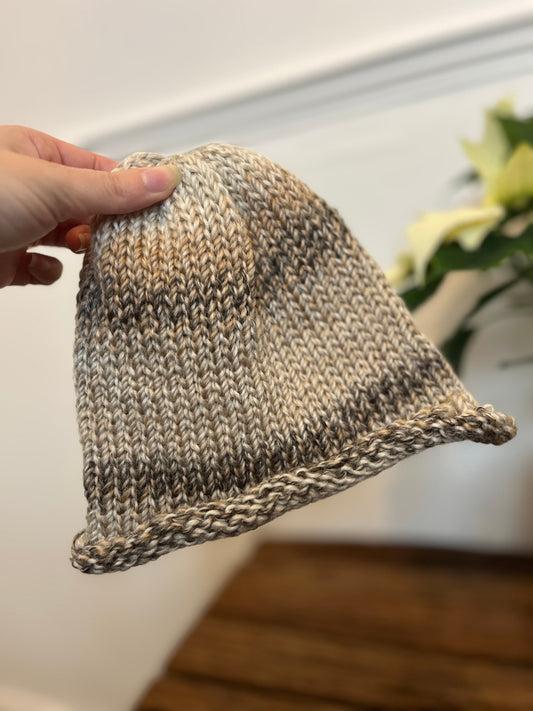 Hand knitted roll hem hat