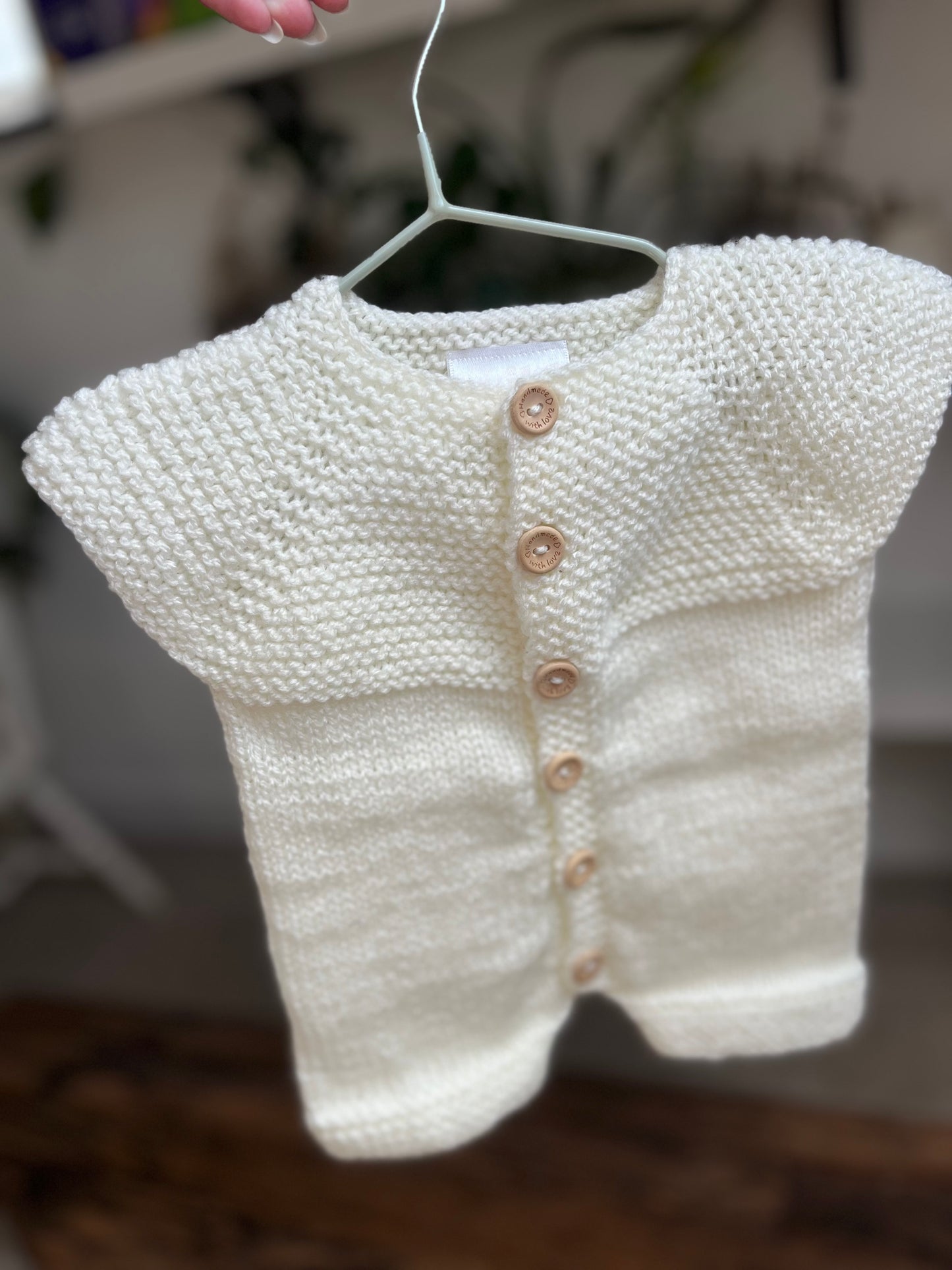 Hand knitted button up newborn romper