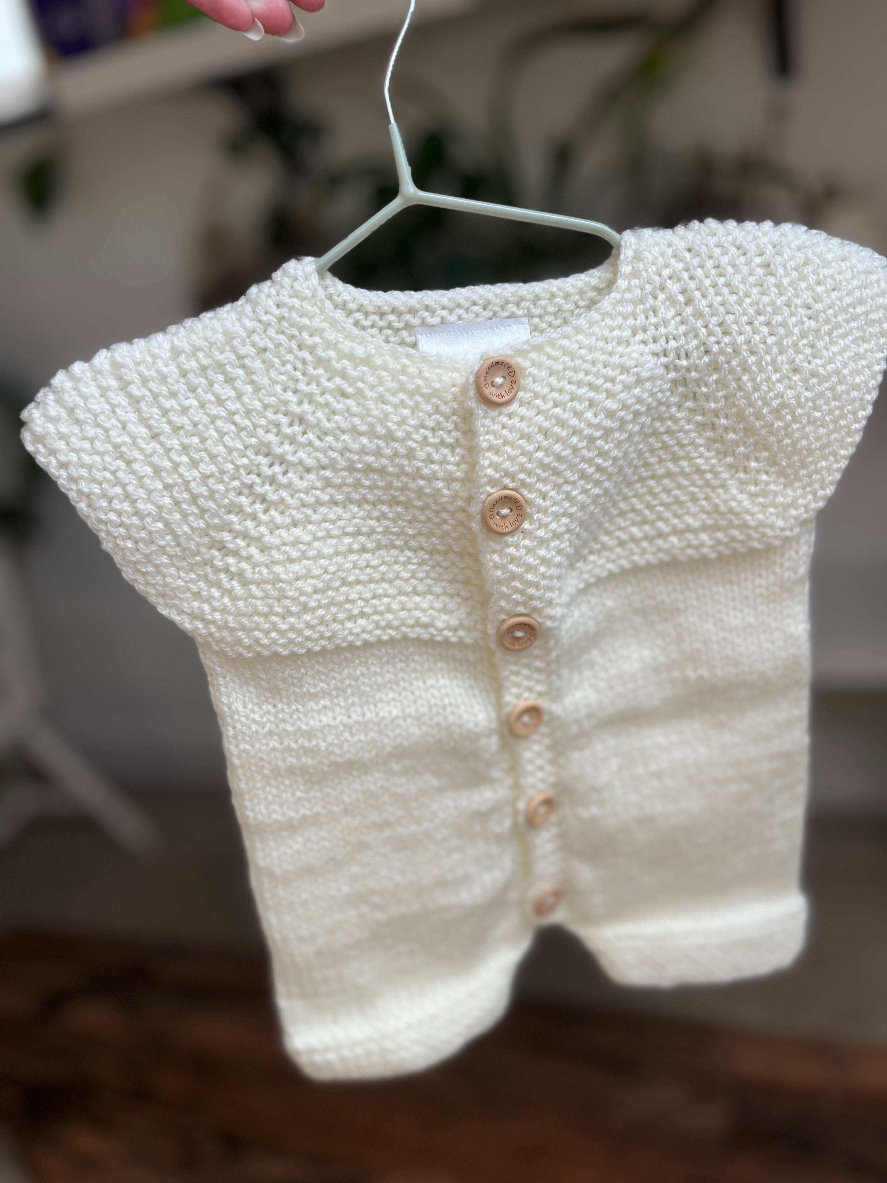 Hand knitted button up newborn romper