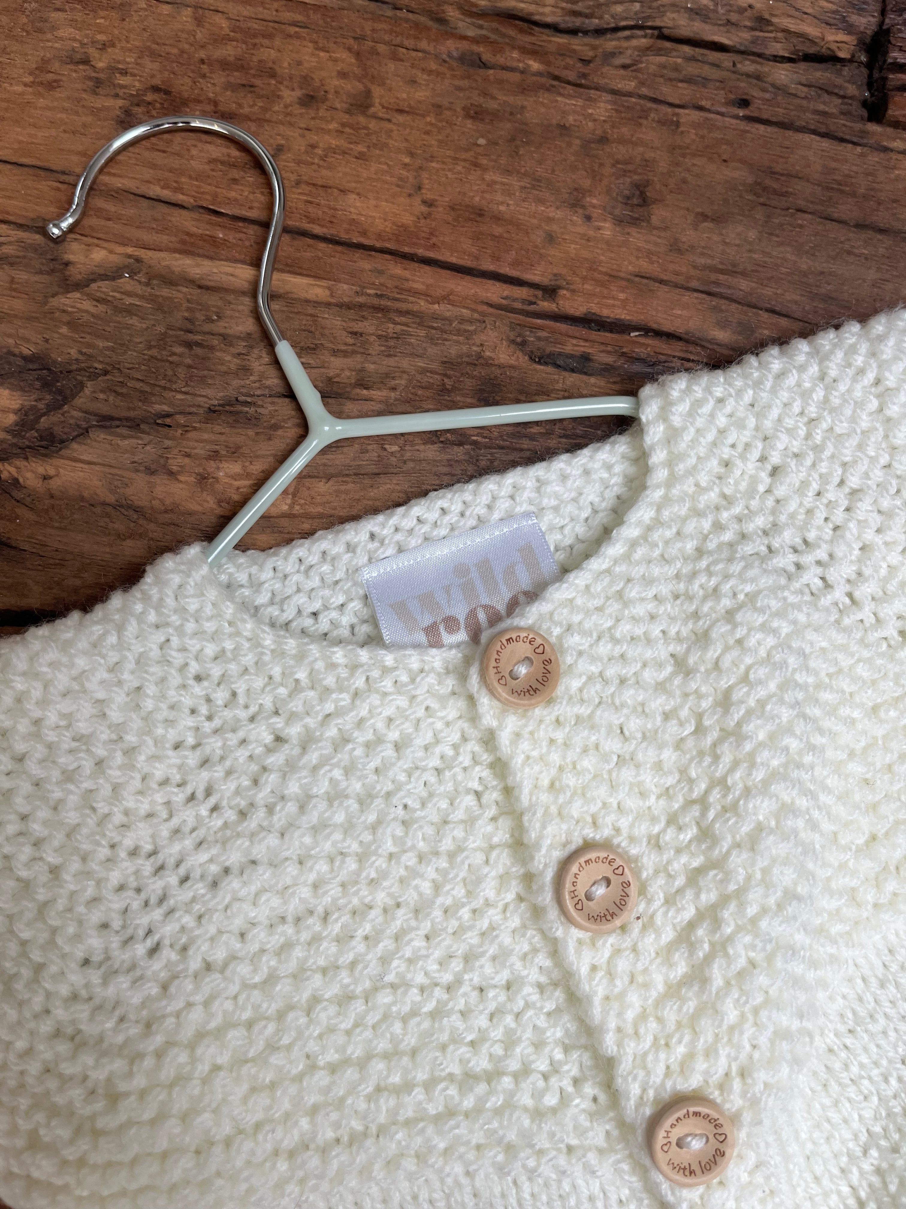 Hand knitted button up newborn romper