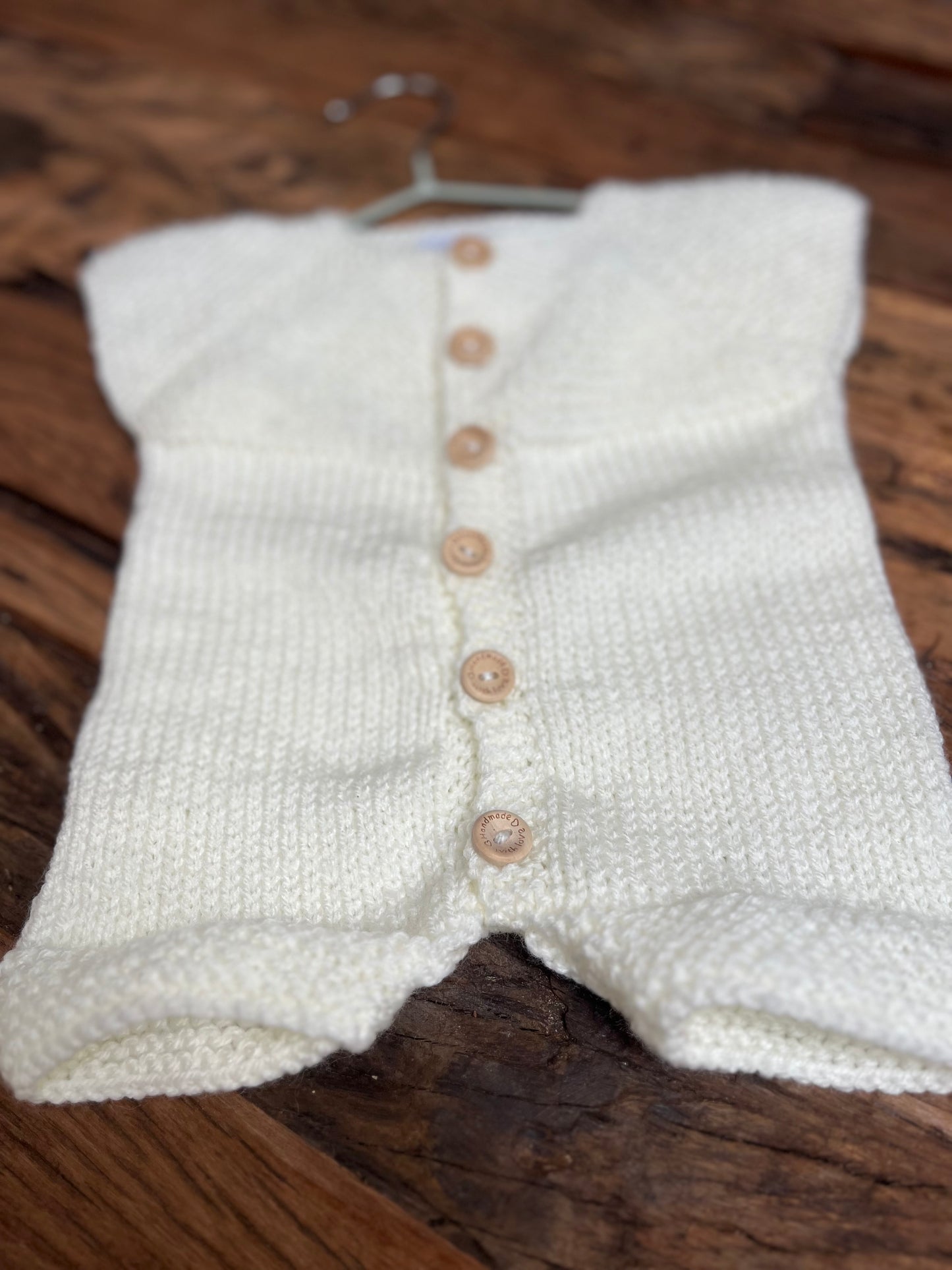 Hand knitted button up newborn romper